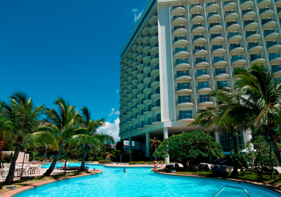 Outdoor pool Poolside area with beautiful contrast between green and blue sky