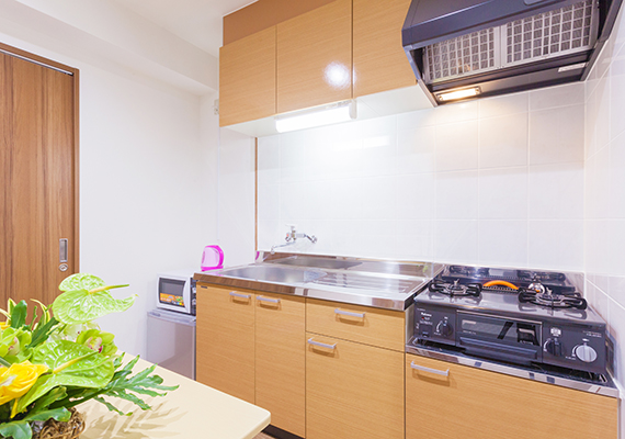 Kitchen with gas stove.