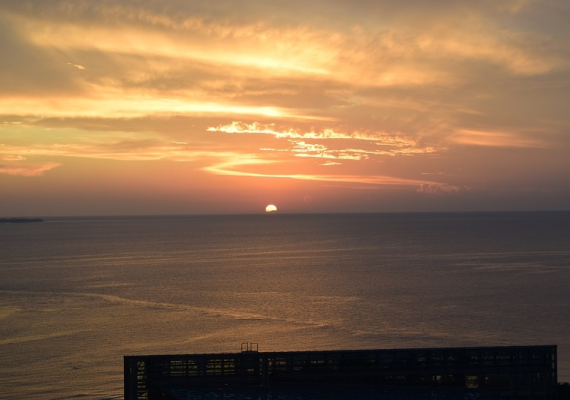 A splendid scenery created by the sunset and ocean view from the room
