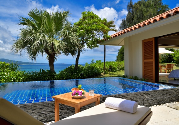 Club cottages for adults lined up at the tip of the cape