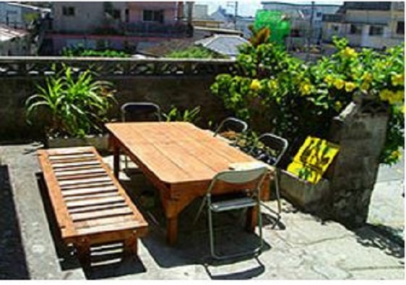 Terrace surrounded by greenery. 
