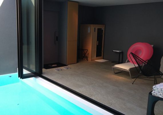 This room offers a view from the pool and has a direct access pathway from the pool to the bathroom.