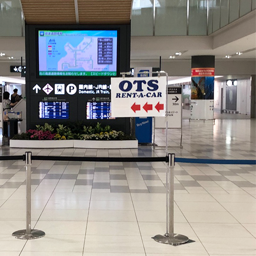 After exiting the arrival gate, turn left towards the Tour Desks.